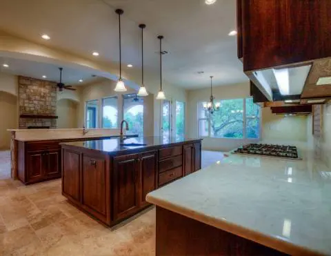 Marble countertops and wooden cabinets