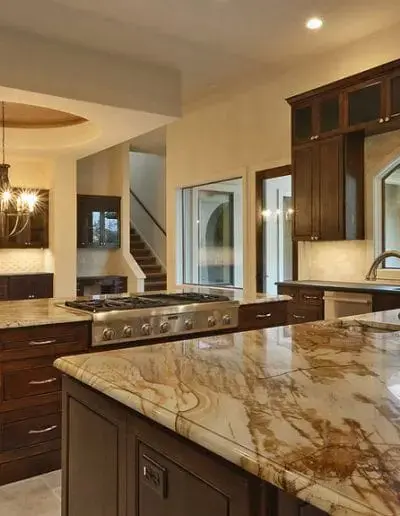 A marble countertop beside a stove